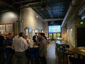 image of people talking in a bar