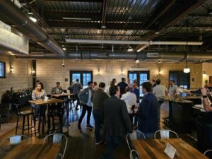 image of a group of people talking in a bar